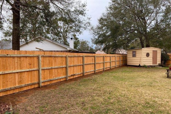 Wood fence installation in Pace Florida